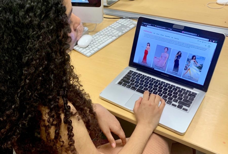 Prom Prepared: North Atlanta students like junior Leah Overstreet carefully navigate through websites and stores to choose their prom dresses this year.