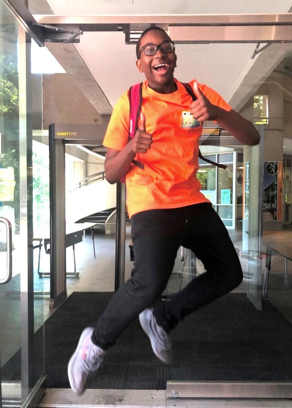 Dubs’ Delight: Like many of his peers, freshman Jaden Gaillard leaps for joy at the thought of the school year ending. 
