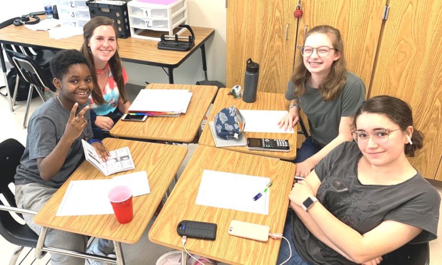 Hitting the Books: Freshmen Eliza Kennedy, Andrew Weeks, Kathryn Ackerman, and Natalia Perez study hard during their ELT class.