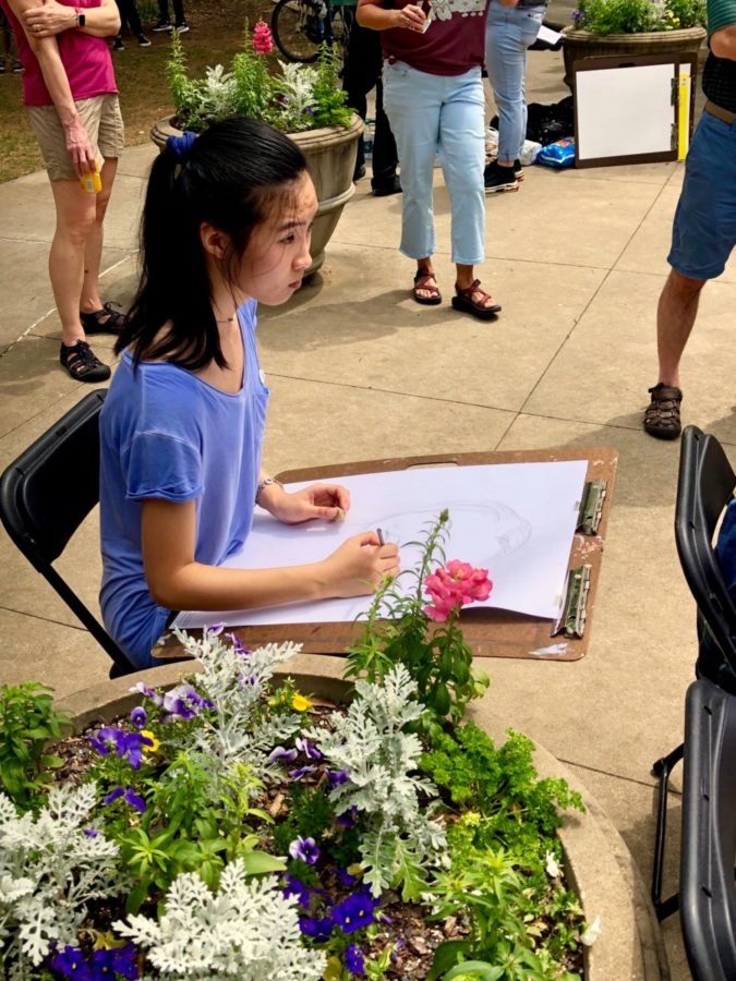A student attending the Dogwood Festival participates in the art activities set during the events.