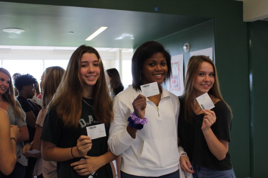 Smiles Ready!: Sophomores Aislin Ward, Avery Horton, and Julie Barfield gear up to take their yearbook photos. 