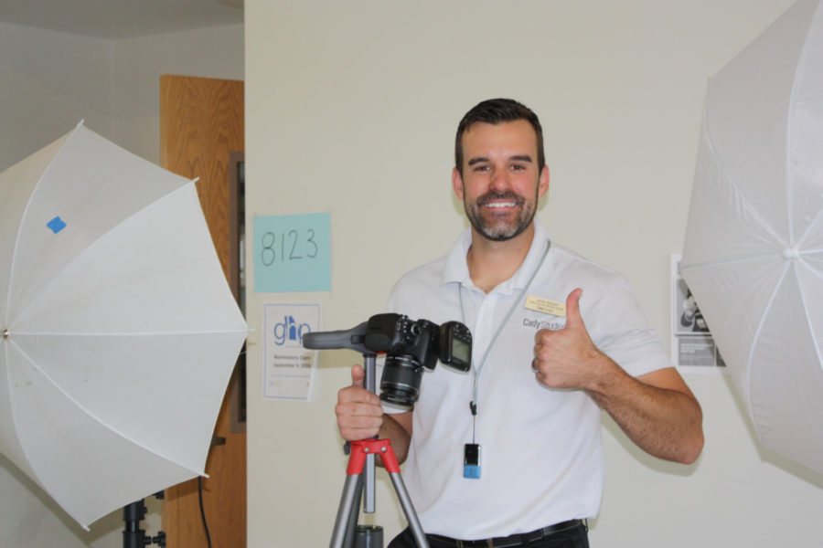 Thumbs-up: A Cady Studios photographer smiles for the Warrior Wire cameras between photos.