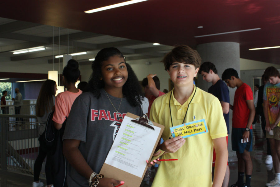 Hard at work: Picture day runners Payton Jones and Russel Makepeace make sure each class gets their picture taken. 