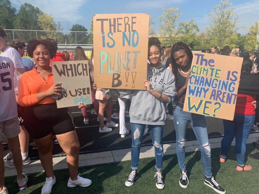 Marching for a Cause: North Atlanta seniors (left to right) Janejha Jones, Aria Thomas, and DeAsia Doser. walk out of class to raise awareness of climate change
