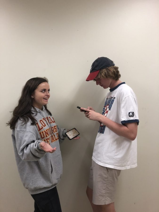 Phone Fiends: Students are phone obsessed (Left to Right Kate Whilloby, Foard Martin, both juniors)