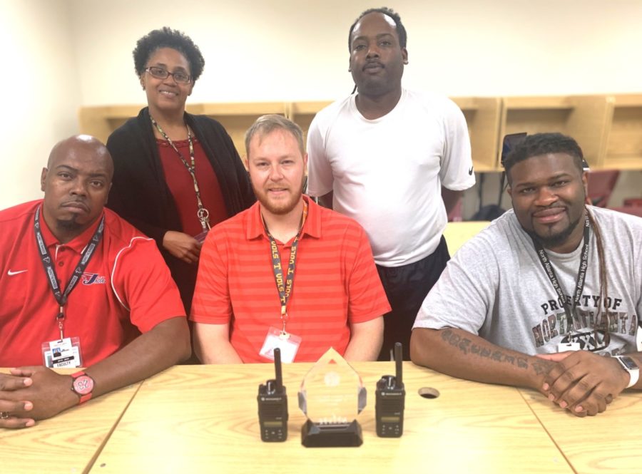 Monitoring Progress: The school’s dedicated hall monitors are committed to ensuring that students are in class. Shown are (front) Jermaine Stephans, Ture Mackall and William Leonard. Back row are Carolyn Robinson, ISS coordinator, and Lee Hill. The hall monitors and Robinson recently won the school’s “It Takes a Village Award” in recognition of their hard work. Photo Credit: Michael Dobson