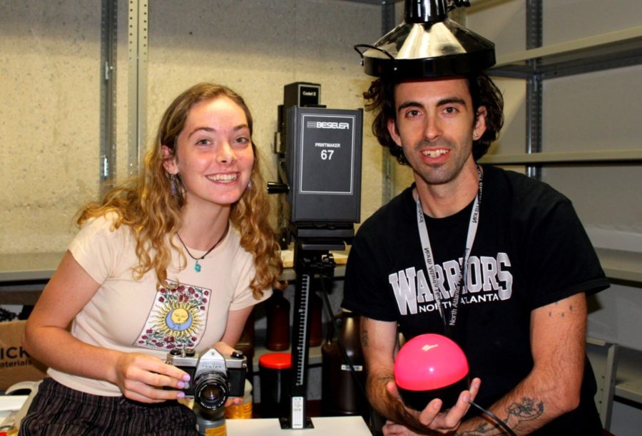 Shot in the Dark:Junior Skylar Charlesworth and art instructor Jordan Grimes make use of the new photography dark room 