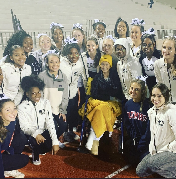 
A true Warrior: The North Atlanta cheer team honors senior Catherine Williams during her fight against osteosarcoma.