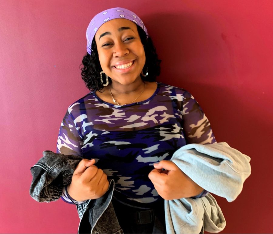 Bargain-O-Rama: Thrifty senior Lenox Johnson poses with some fashionable items she got on discount at an area thrift store. 
