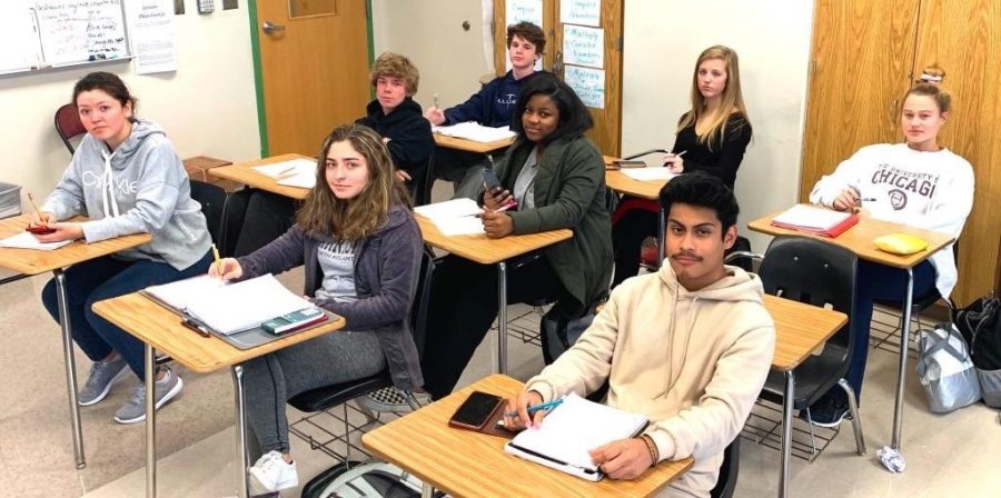 Operation Avoid Tests: Students are chattering about changes to the policies associated with who can and cannot exempt their end-of-semester finals. Shown are students in Ms. Lashawne Miles’ Algebra 2 class: Front row: senior Sandra Zurita, junior Aaliyah, Roach, sophomore Jairo Venancio; middle row: junior Mitchel Harbolt, junior Destini Togba; back row: sophomore Bryce McGowan, junior Graham Barnette and junior Kate McCabe. 
