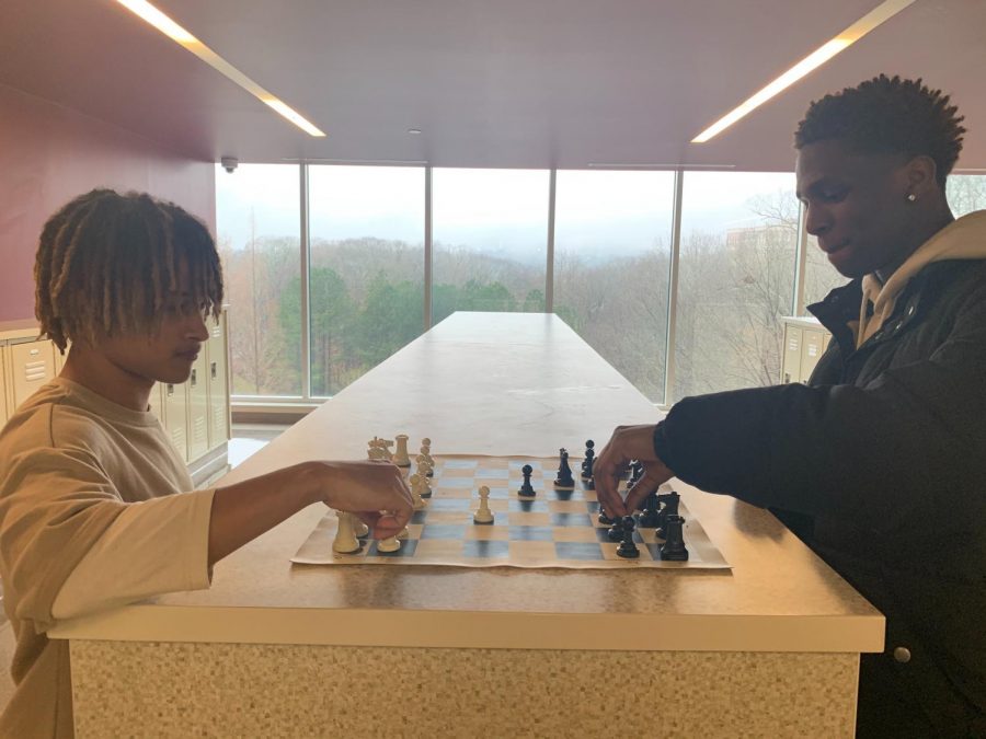 Checkmate: James Williams (9th) Jaden Cotton (12th) play chess in the hallways