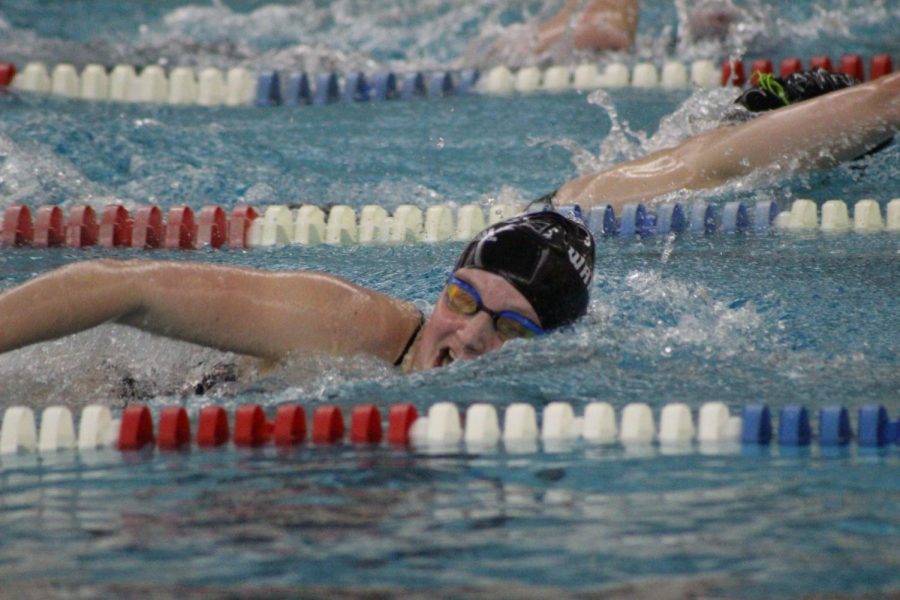 Caption: Junior Zoe Mock swims a fast freestyle for her relay showing of that Warrior talent!