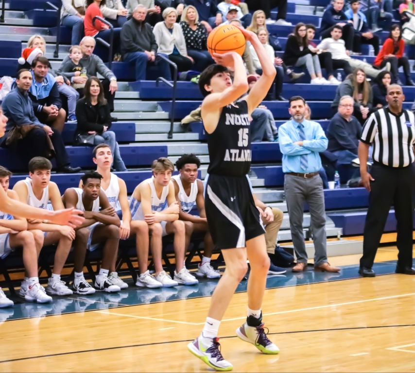 Basketball Star:Charlie Hamilton hoists up a jumper versus Cambridge.
