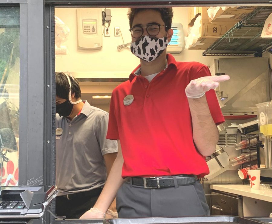 My Pandemic Pleasure: During a time when most workers in Atlanta are ensconced safe in their lockdown existences, senior Kevin Lockhart tirelessly works long hours at a drive-through window for Chick-fil-a. He is one of many North Atlanta students working frontline jobs during the COVID 19-related quarantine. 

