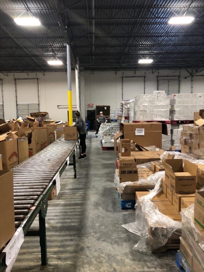 Caring for the Community: Warriors take safety precautions seriously while volunteering at the Atlanta Community Food Bank and other organizations.