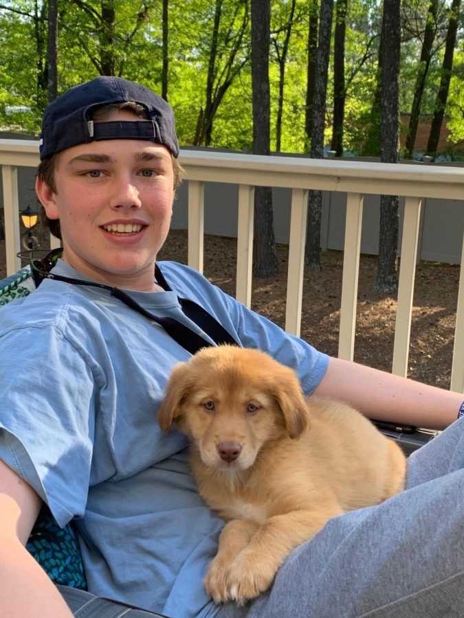 Pets of the Pandemic: Junior Holt Marbut enjoys some time outside with his new puppy, Blue.