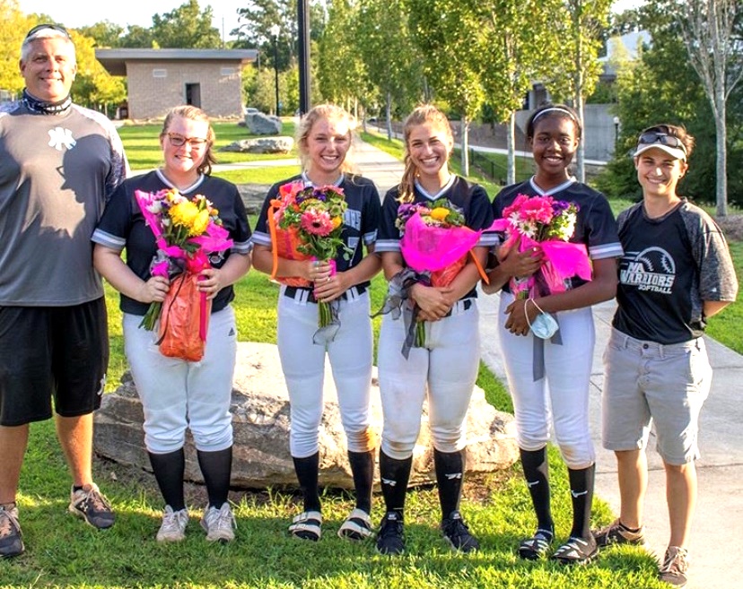 Night to Remember: What better way for the softball Dubs to celebrate their senior night than by putting an old-fashioned 13-0 drubbing on cross-town rivals Grady High School. The Class of 2021 seniors were part of a dramatic program turnaround for the school’s softball program. From left to right are Coach Ricky Plante, Emily McGreevey, Katherine McWhirter, Jillian Dacey, Daishalyn Satcher and Coach Wren Williams. 
