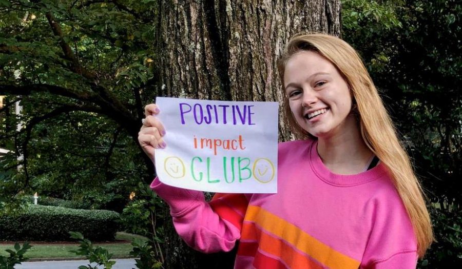 All Smiles: Senior Lucy-Grey Shields, who wanted to bolster positivity in a pandemic-era that could use it, established the North Atlanta Positive Impact Club in order to convert Dub Downers into Warrior Winners. 