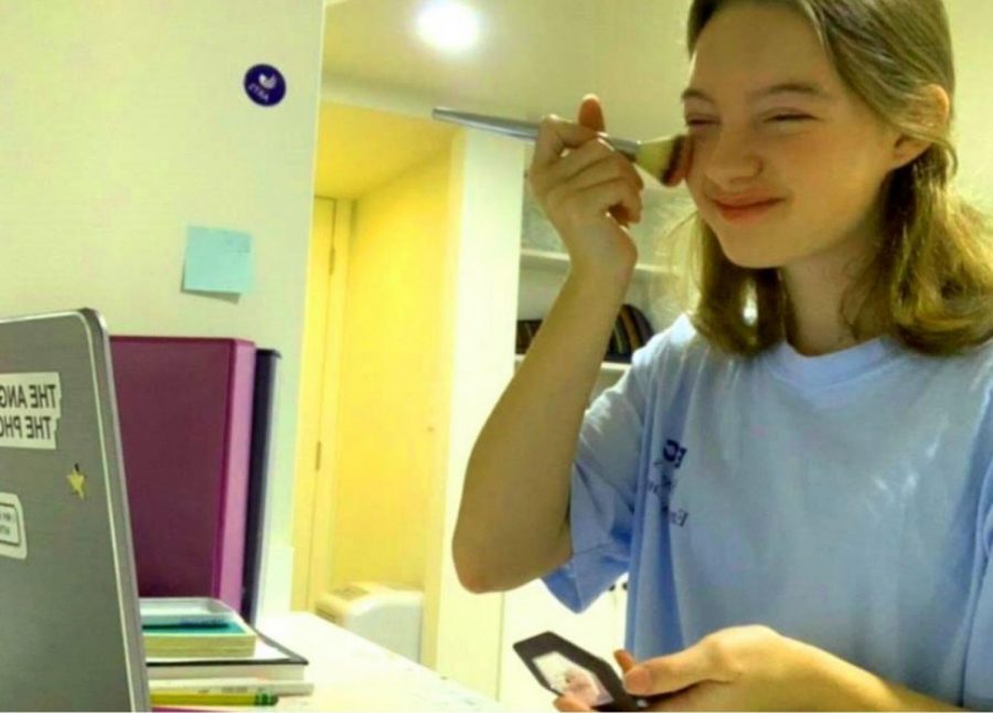 She’s Blushing: Junior Kathryn Ackerman does at least a semblance of “get-ready” activities before joining her first class of the day on Zoom. Remote education has given students a whole new range of morning routines. 

