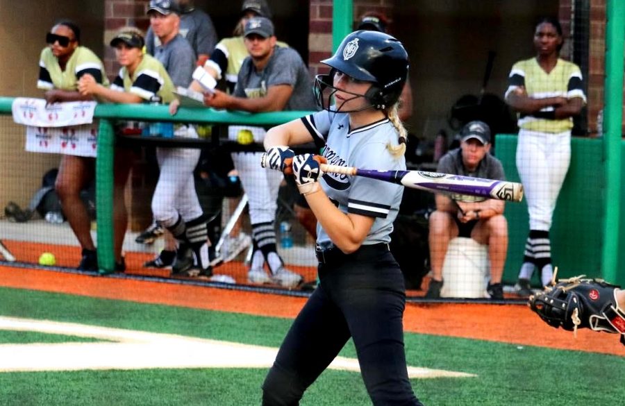 Fall Into Sports: Senior Katherine McWhirter takes her best swing at the plate during a recent Dubs softball game against Mountain View. For all North Atlanta sports teams, new challenges – beyond just heady competition – are presenting themselves in a COVID-impacted sporting environment.    