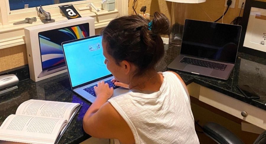 Sneak a Peek: Virtual education opens up a host of new... educational enhancements. A freshman - who asked to remain anonymous - takes a look at her book during a quiz