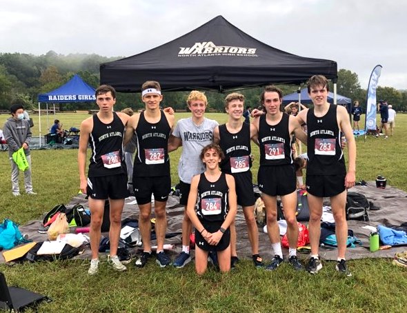 One for All: The varsity boys Running Warriors in a celebratory mood after a strong showing at a recent meet. Picture here are Andrew Churchill, Ethan Curnow, Teddy Meredith, Sumner Kirsch, Randall Semancik and Charlie Haines; (kneeling) Holt Harris. 
