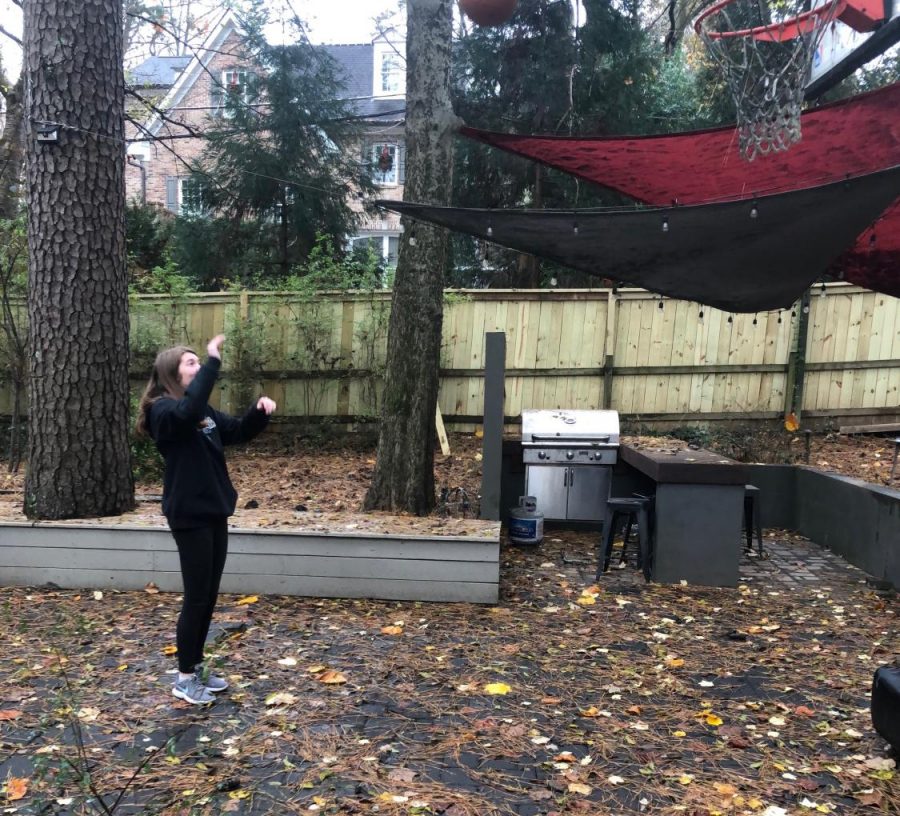 Nothing But Net: Sophomore Kate Zappa brushes up on her basketball skills to get in shape over quarantine.