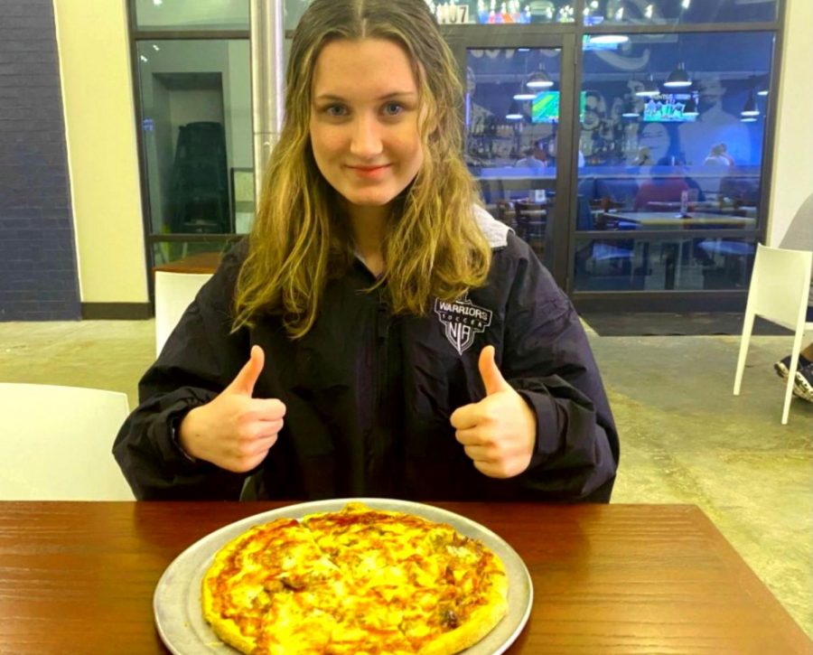 Lets Eat! Wire staffer sophomore Caroline Feagin gets ready to dive into a pizza pie from the popular pizza joint, Westside Pizza. 