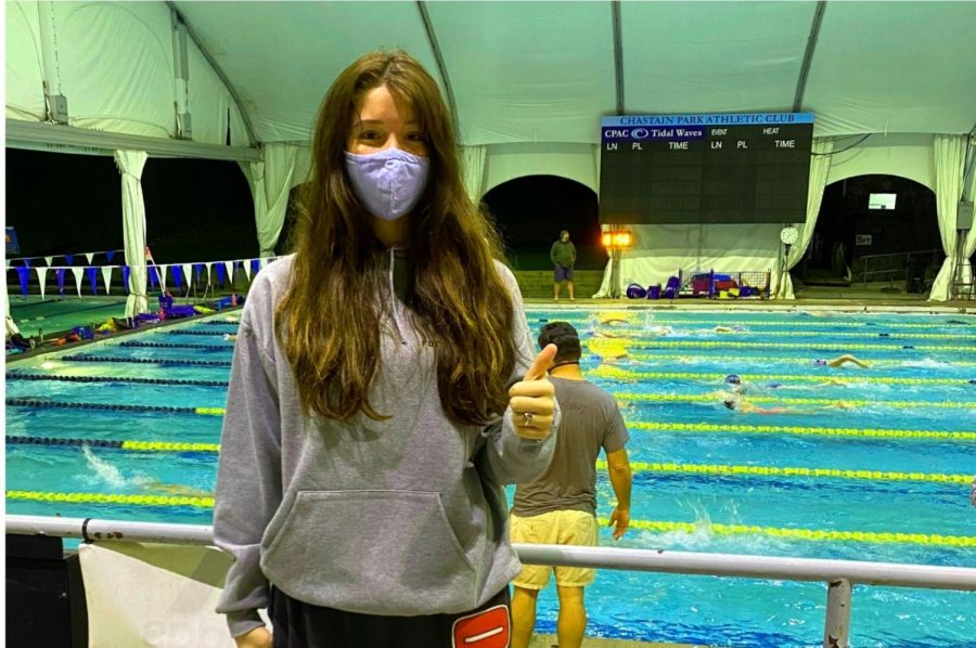 On Deck: Junior Aislin Ward follows proper swimming protocol before practice. 