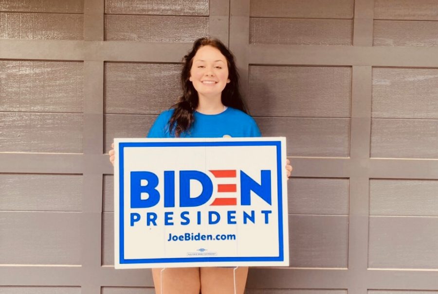 Lets Get Political: Politics is a very prevalent topic in todays society, and Dubs are no exception. Some students find that with access to a greater amount of information, they may develop beliefs different from that of their parents. Shown above is sophomore Juliette Holzworth sporting the sign of the political candidate she supports.