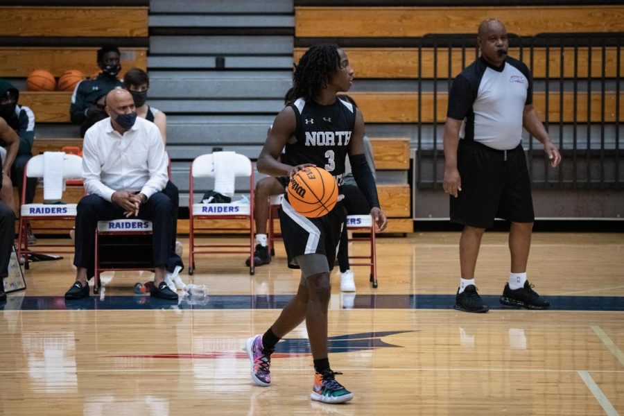 North Atlantas Khamani Oliviacce (13 points, 8 assists) surveys the floor against Riverwood.