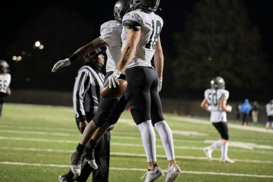 In celebration senior Tight End Ned Coleman and freshman Running Back Quintarion Kelley chest bump.