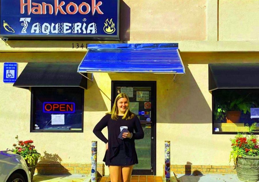 Taco Tuesday: Junior Katy Wilbanks stands outside Hankook Taqueria, a whole in the wall restaurant that serves up a fusion of Korean-Mexican delight. 