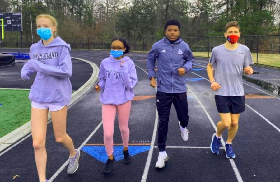 Race Is On: Even in the face of COVID challenges, Warrior spring season athletes are rushing headlong into competition. The track and field team under the direction of Coach Bryce Doe is one of many sports teams readying itself for competition to come. Shown here training on the North track are freshman Catherine Townsend, sophomore SeLah Robinson and seniors Syre Stewart and Ethan Curnow. 