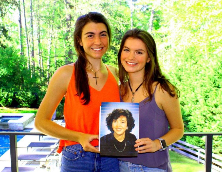 A Cousin Remembered: Junior Evelyn Iwanicki and sophomore Tanner Adams hold a photo of their cousin Madeline Adams who died in 1992 at age 24, long before the current North Atlanta students were born. To honor the memory of their relative who died after a fight against blood cancer, the first cousins spearheaded a fund-raising campaign for the Leukemia & Lymphoma Society and in the process raised more than $100,000 to fight the disease that took their relative’s life. 


