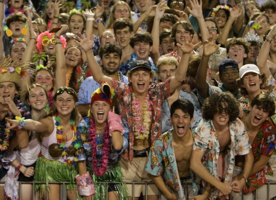 Welcome Back Warriors: The Dubs show out in full luau attire to demonstrate their support at the first football game to have a student section in nearly two years. The Warriors took home the dub, winning the opening-season game 10-7 against Wheeler High School.