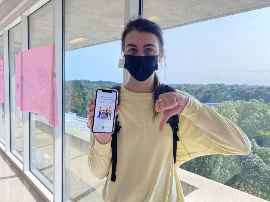 Taxing Tardies: Pictured above is senior Evelyn Iwanicki frustrated with the HealthCheck app that although necessary, is ultimately responsible for many morning tardies. The notorious elevators and stairs are an additional obstacle Dubs face in getting to first period on time.