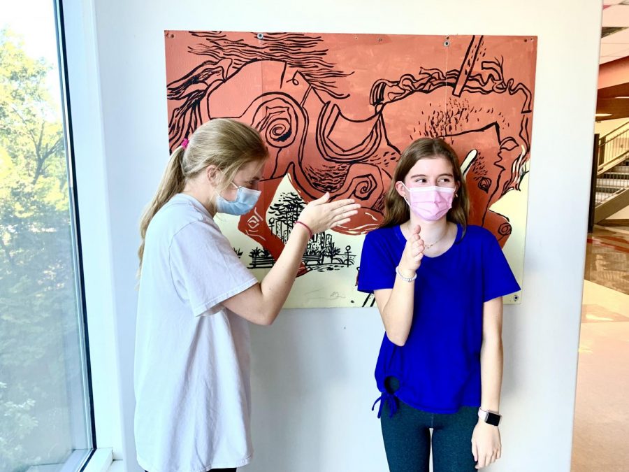 POV: Juniors Caroline Edwards and Elizabeth Ackerman demonstrate Boi, one of the many new terms in teens current diverse vocabulary.