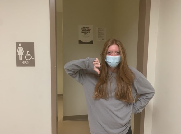 Vain Vandals: Due to a popular TikTok trend called "Devious Licks," North Atlanta's bathrooms have been damaged by participants of the trend. Pictured is sophomore Stacy Carter showing her disapproval of the trend.