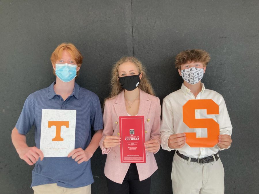 College on the Come-Up: Dubs start thinking of their post-NAHS plans with the help of the College Fair. Juniors Hugh Breeden, Juliet Joyce, and Carter Martin show off their college paraphernalia.  