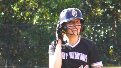 Dedicated Dubs: Junior Warriors are working overtime (literally) to keep up with their workload, after school jobs, and extracurriculars. Pictured above is Mia Alarcon playing hard at her after-school softball game before going home to complete mountains of schoolwork.