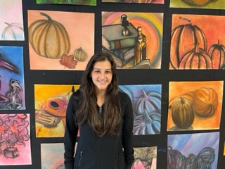Painting Prodigies: Through its exceptional teaching and curriculum, the North Atlanta art program is priming creative Warriors for artistic excellence. Sophomore Emerson Crow is pictured above in front of just a few of the many outstanding Dubs' creations displayed throughout the building.