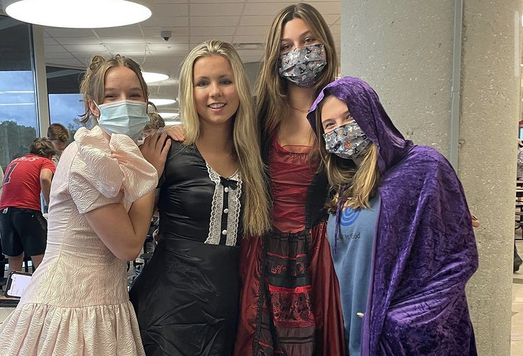Eerie-sistible Costumes: Spook Week at North Atlanta was a time for students to show off their school spirit in theme for Halloween. Juniors Nicole Stevens, Anna Rohn, Ella McCabe, and Macy Margulis show off their spook-tacular costumes. 