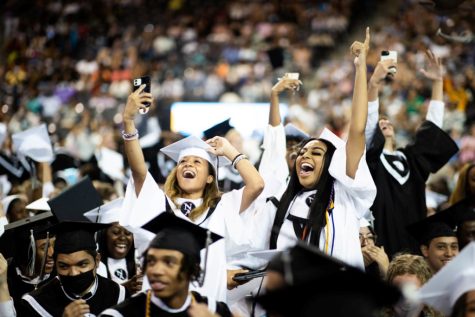 Sage Glover and Kalani Gilliam take in the moment in Georgia Tech’s McCamish Pavilion when they and their peers were christened as official graduates of North Atlanta High School. 
