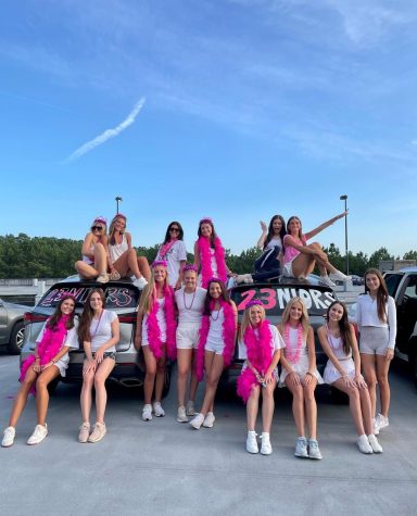 First Day of School Prep: Several senior girls gather at the top of the parking deck on their final night of summer break to paint their cars and ring in the new school year. 
