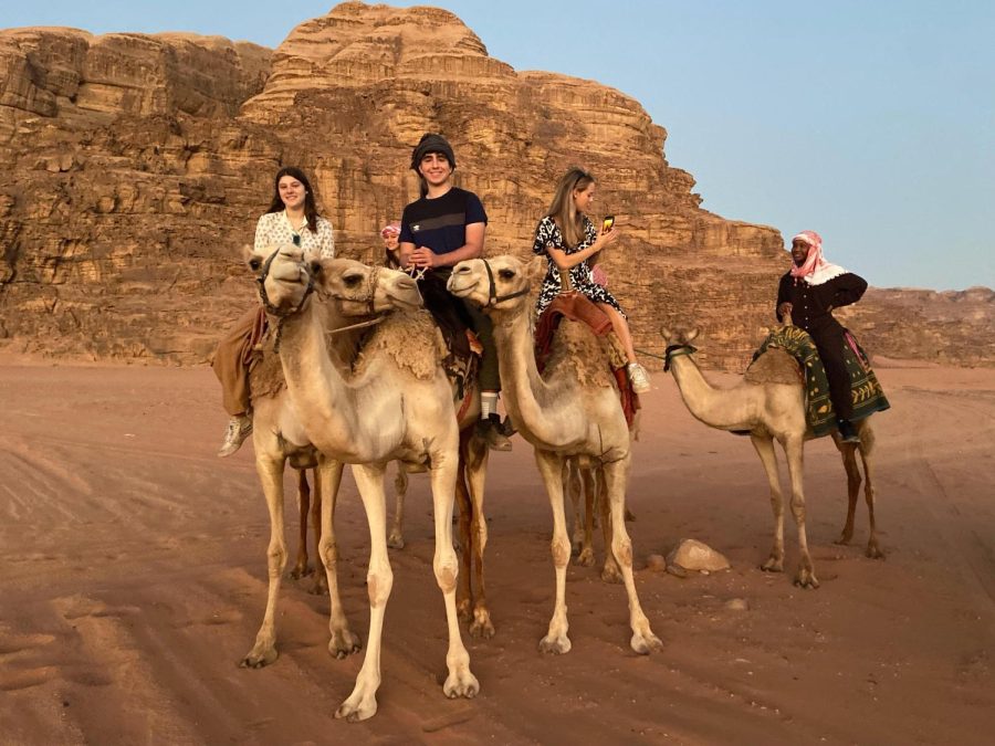 Dub Ryder Zufi is joined by wordly program participants touring Wadi Rum via camel during their three-week immersion program with Arabic teacher Awad Awad in Amman, Jordan.