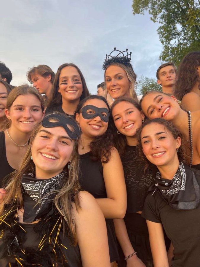 Dub Spirit: Seniors Elizabeth Ackerman, Lucy Marin, Marley Jones, Gabby McCaffrey, Ava Geller, Alexandra Golomb, Brett McPherson, and Eliza Huntz support the Dubs in their blackout best.