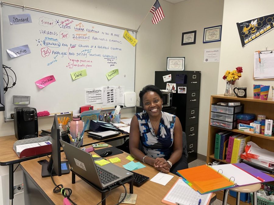 Familiar Beginnings: Dawnitra Quigley settles into her new classroom, full of color and fun, after making the transition from Sutton Middle School to North Atlanta High School.