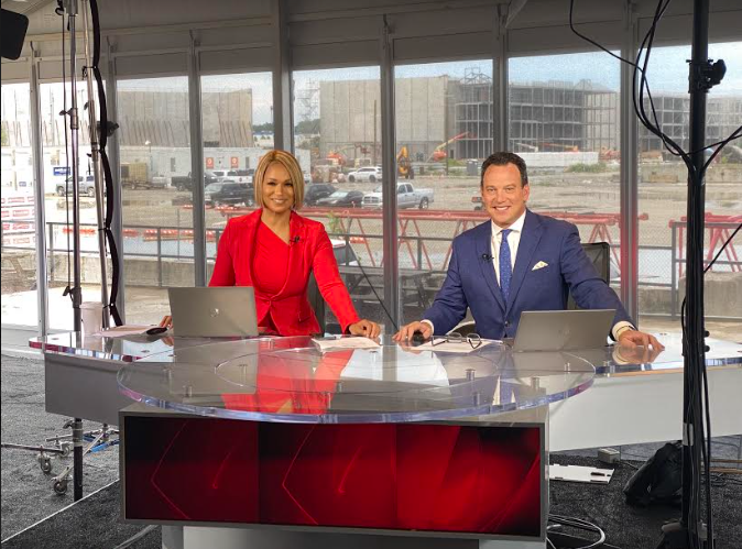 Behind the Camera: Rick Folbaum and Shon Gables sit proudly at their standing tables at CBS46 in Atlanta, ready to report!