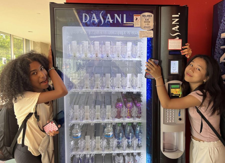 Vending Veterans: Sophomores Nadia Davis and Karli Chan (literally) grasp onto fond memories of vending machines once filled with snacks.